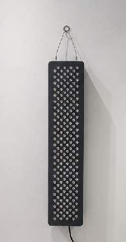 Akron Cryo's actual wall-mounted red light therapy panel with lights switched off
