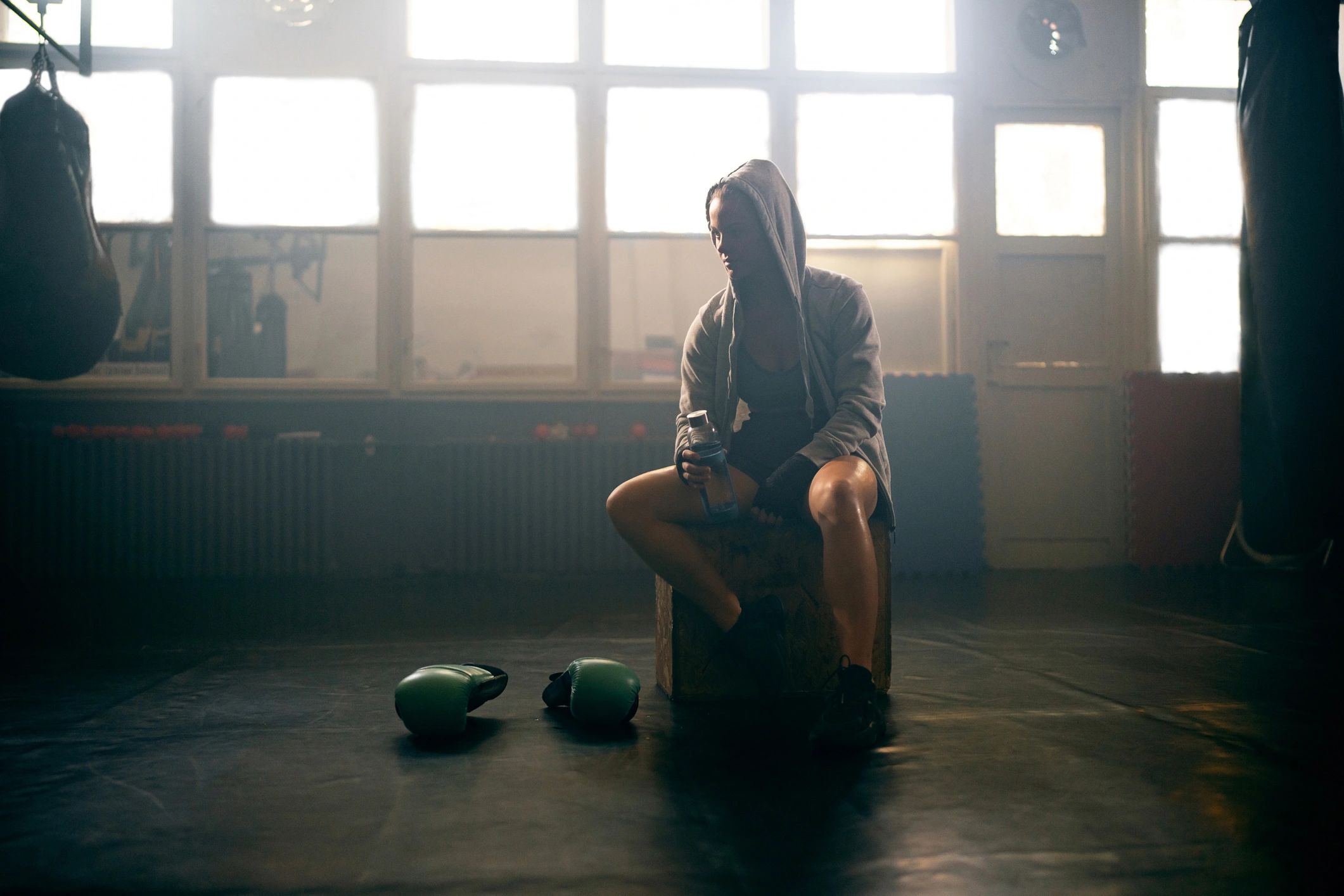Athlete resting after training, representing recovery and performance support